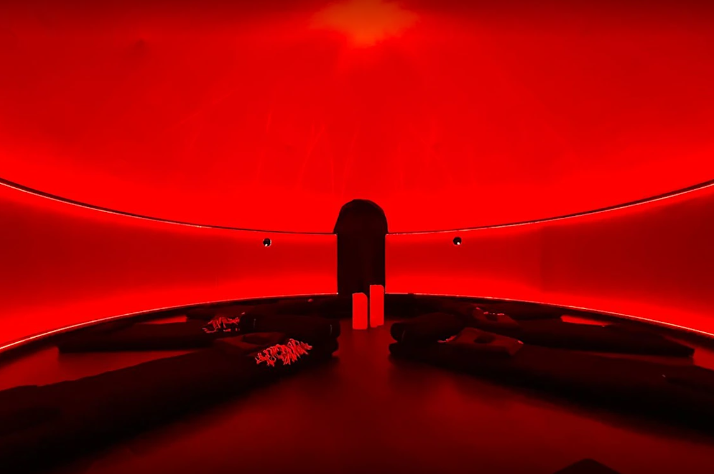 The Sensorium dome bathed in deep red — sound bath setup